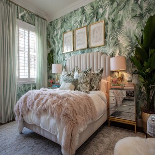 Eclectic Master Bedroom Design With Tropical Wallpaper And Beige Headboard