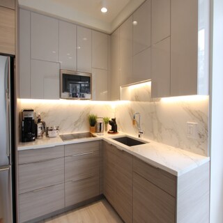 Minimal L-Shaped Kitchen Design with Quartz Countertops and Two-Tone Cabinets