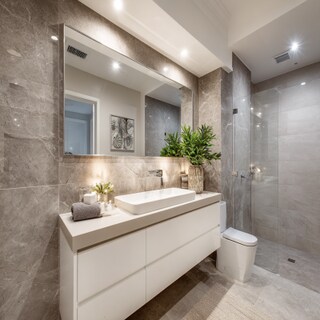 Modern Bathroom Design With Light Grey Tiles And Rectangular Mirror