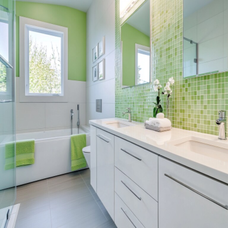 Modern Bathroom Design with White and Green Tile Accents