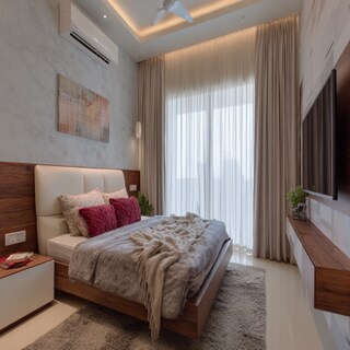 Modern Bedroom Design With A Double Bed And A Wall-Mounted TV Unit