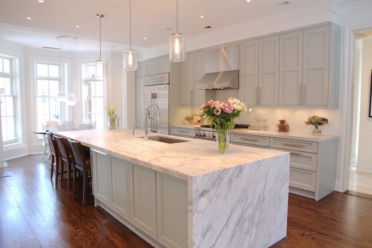 Modern Island Kitchen Design with Marble Countertops and Grey Panels