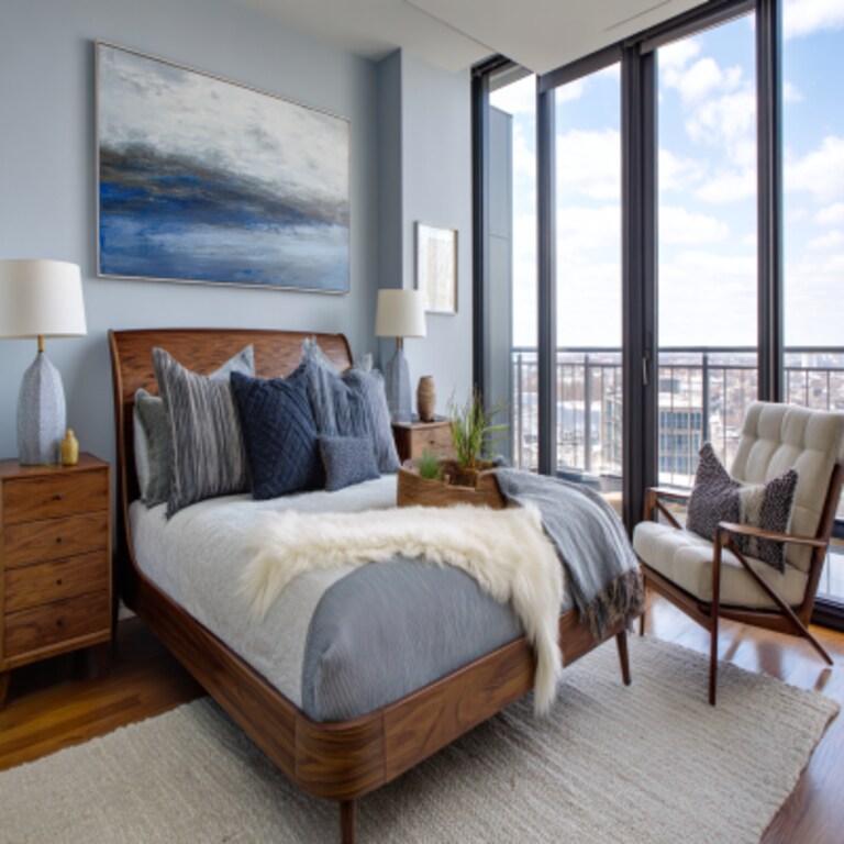 Modern Master Bedroom Design with Wooden Nightstands and Accent Chair