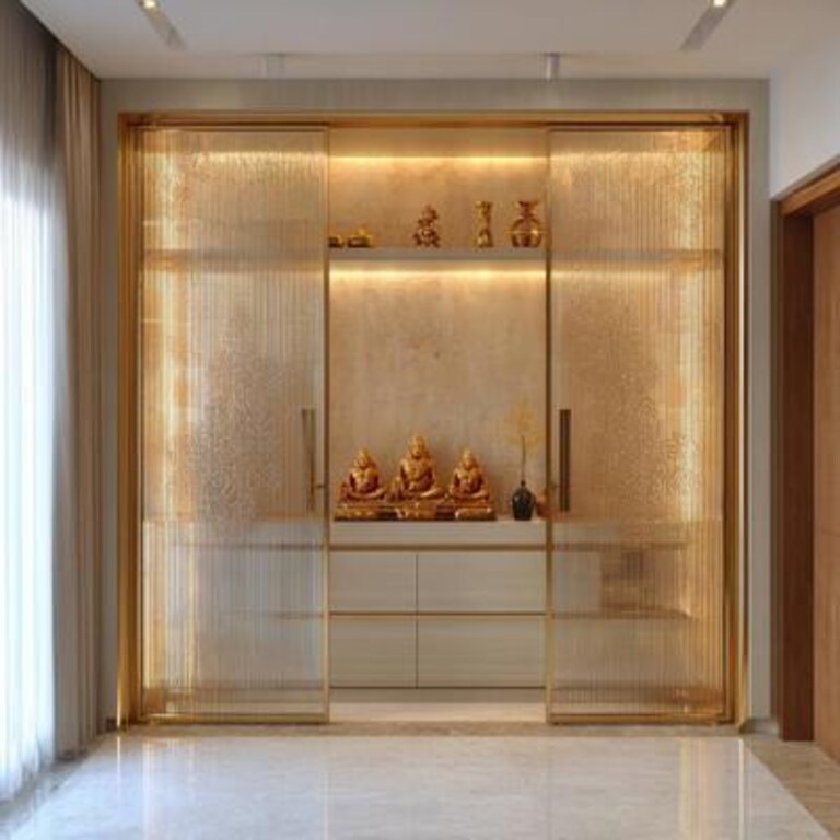 Modern Pooja Room Design with Golden Sliding Doors Fluted Glass and Laser Cut Motifs