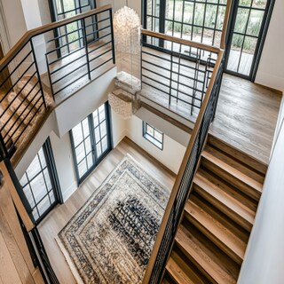 Contemporary U-shaped staircase Design in Wood and Metal