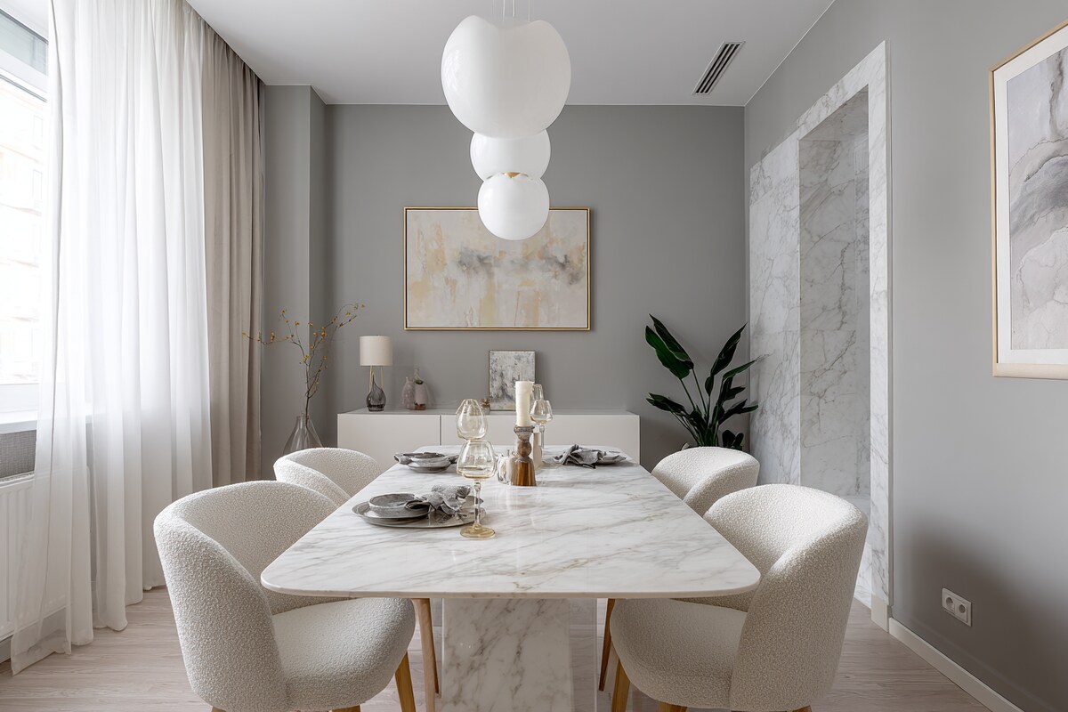 Small Grey and White Wall Colour Combination for Dining Room with Marble Table and Upholstered Chairs