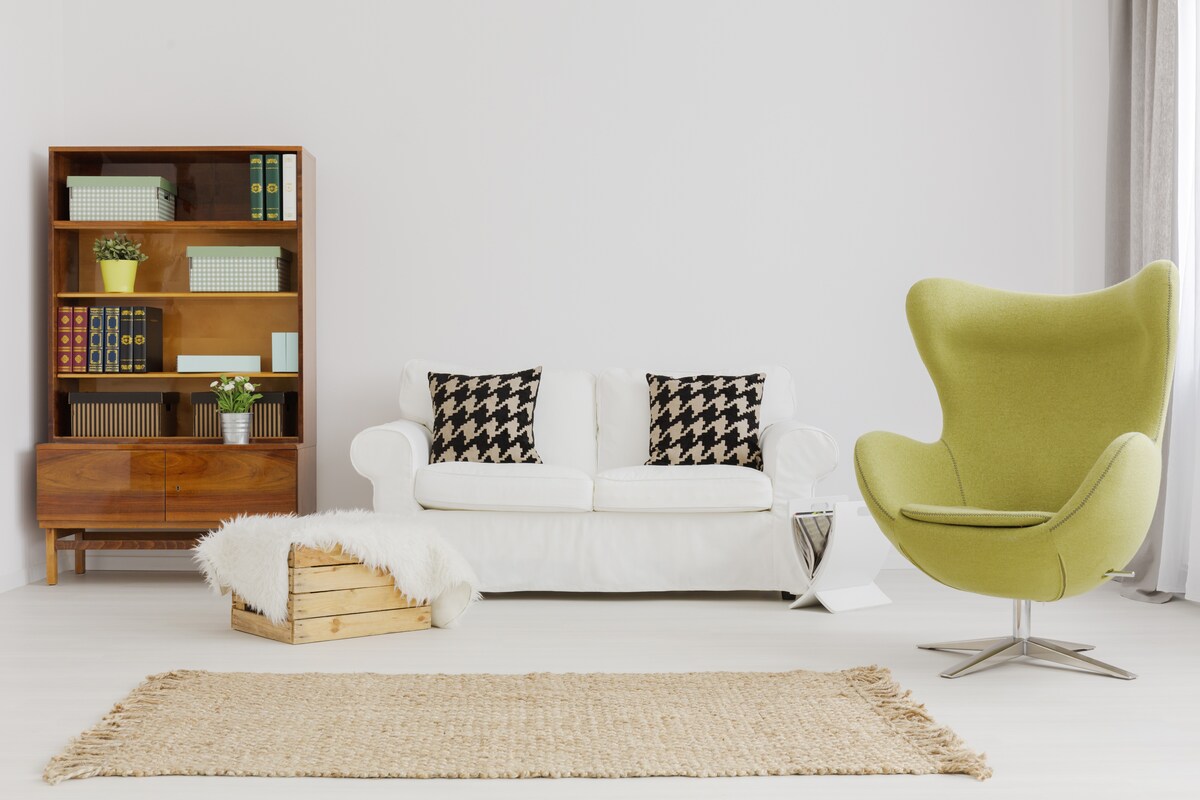 A Stylish Living Room Design With Green Swivel Chair