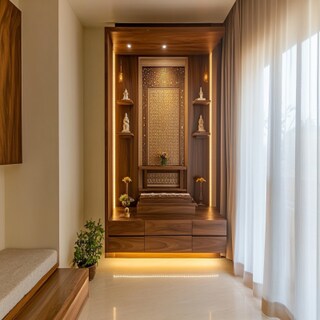 Tall Floor-Mounted Modern Pooja Room Design with Carved Wood Accents